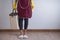 Close up view of body of young woman holding stuff for cleaner ready to cleaning house