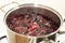 Close-up view of boiling blueberries. Cooking blueberry jam.