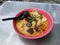 Close up view of a bowl of curry noodles or locally called