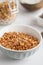 Close-up view of bowl with granola with coconuts and chocolate