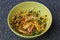 Close up view of bowl with healthy salad of popular sprouts , avocado, pine seeds, turnip. Healthy food concept