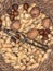 Close-up view of a bowl of peanuts, walnuts and hazelnuts