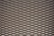 Close up view of bronze colored metal mesh background