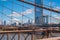 Close up view of the Brooklyn bridge with Empire State building