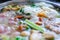 Close up view of bubble water in hot pot with meat vegetables. Shabu Shabu is style beef in hot pot dish of thinly sliced meat and