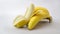 Close up view of bunch and peeled of bananas isolated on white background