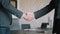 Close up view of business partnership handshake concept.4K footage of two businessman handshaking process. Successful