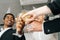 Close-up view of business team of multinational employees holding clinking glasses of champagne