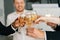 Close-up view of business team of multinational employees holding clinking glasses of champagne