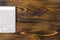 Close up view of a business workplace with wireless computer keyboard, keys on old dark burned wooden table background. Office des