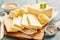 Close up view of butter sliced on cutting board