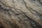 This close up view captures the intricate details and texture of a striking rock face, The uneven texture of a mountain range, AI