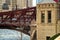 Close-up view of a car passing over a Chicago bridge spanning the frozen Chicago River.