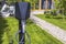 Close up view of charging station for electric car in front yard of townhouse.