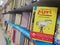 Close-up view of a children`s book cover, thick shelf of children`s books