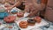 Close-up view of children sprinkling delicious sweet doughnuts