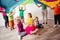 Close up view of children under huge rainbow cover