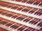 Close up view of a church pipe organ with four keyboards