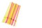 Close up view of colorful drinking straws on white background isolated