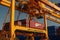 Close up view of container ship under loading. Freight vessel at the berth in cargo terminal. Port cranes loading