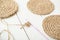close up view of crocheting jute coasters, eco natural home decor. hand made coasters on a table, knitting process. DIY