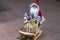 Close up view of cute santa clause figure on sled.