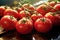 Close-up view of delectable red tomatoes resting enticingly on the table. Generative AI