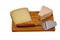 Close up view of different kinds of cheese with cheese knife isolated on wooden board. Healthy food concept