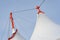 Close up view of the distinctive white roof canopy with orange tips at Ashford Outlet Center, Kent, England.