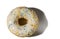 Close up view of donut sprinkled with multicolored glaze isolated on white background.