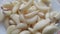 Close-up view of dry peeled garlic clove background