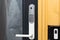 Close up view of an electric combination lock on a black door. Interior design.