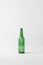 close up view of empty glass bottle isolated on grey, recycling concept