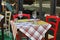 Close up view of empty quaint little restaurant with tables set on the sidewalk