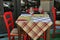 Close up view of empty quaint little restaurant with tables set on the sidewalk