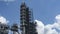 Close-up view of factory on oil refining. Petrochemical industrial plant on the classic blue sky background. Space for text.