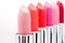 Close-up view of fashionable lipsticks in red and pink colors in a row