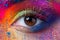 Close up view of female eye with bright multicolored fashion mak