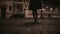 Close-up view of female feet walking through the deserted street in the evening. Lonely woman going home late.