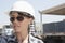 Close-up view of female industrial worker wearing hardhat and sunglasses