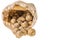 Close up view of fresh potatoes in paper bag isolated on white background. First harvest.