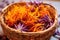 close-up view of fresh saffron stigmas in a basket