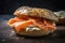 A close-up view of a freshly baked bagel with dense texture, toppings, and smoked salmon