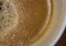 Close-up view of a freshly made cup of hot Americano coffee seen in a ceramic mug.