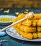 Close-up view of fried pastry coated in honey