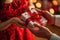 A close-up view of a gift exchange between two individuals, with a woman elegantly dressed in red, receiving a