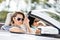 Close up view of girls in sunglasses in the automobile