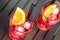 Close-up of view of glasses of spritz aperitif aperol red cocktail with orange slices and ice cubes