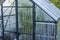 Close up view of greenhouse with condensation on windows walls.