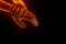 Close up view of hand grabbing hand with light fire glowing 3D effect. Helping each other concept